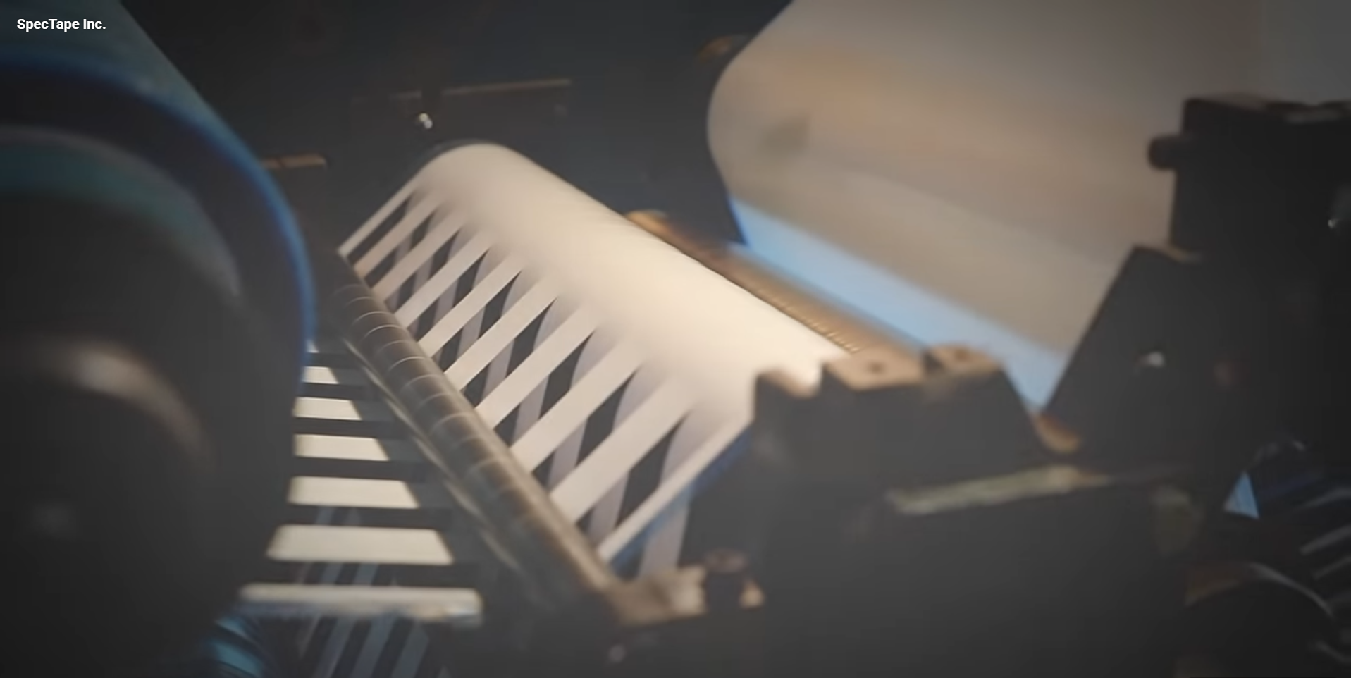 SpecTape Inc. slitting blades close-up — precision tape converting in Erlanger, KY